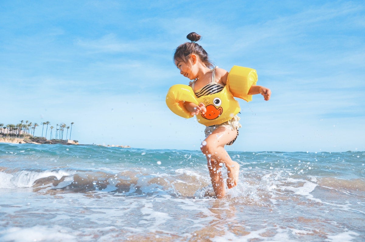 child-playing-on-beach-turks-and-caicos