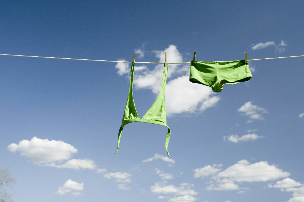 hang dry swimsuit on clothes line outside blue sky-min