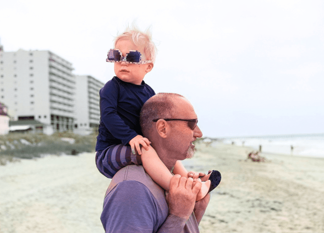 man-kid-on-shoulders-sunglasses