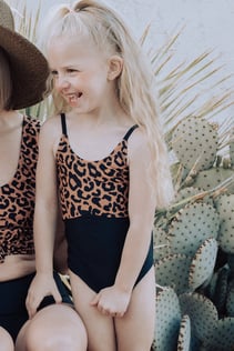 toddler-in-leopard-print-swimsuit-min