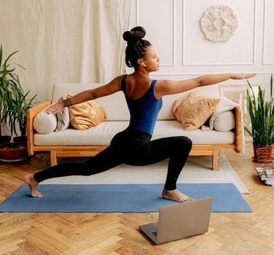 woman-doing-yoga-in-studio-min