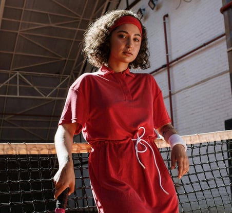 woman-wearing-red-sweatband-badminton